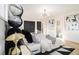 Bright bedroom features an eclectic design with hardwood floors and unique decorations at 3388 Hyland Dr, Decatur, GA 30032