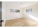 Bright, airy bedroom with two windows and light-colored wood flooring at 3388 Hyland Dr, Decatur, GA 30032