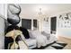 Bedroom features a unique black headboard design, wood floors, and striking contemporary art at 3388 Hyland Dr, Decatur, GA 30032