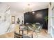 Stylish dining room features a modern light fixture and accent wall with light wood floors at 3388 Hyland Dr, Decatur, GA 30032