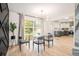 Modern dining area with stylish lighting, open to the kitchen with plenty of natural light at 3388 Hyland Dr, Decatur, GA 30032