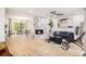 Open floor plan with fireplace, dining area, modern furniture, and natural light at 3388 Hyland Dr, Decatur, GA 30032