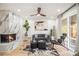 Stylish living room showcases a marble fireplace, modern fan, and ample natural light at 3388 Hyland Dr, Decatur, GA 30032