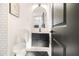 Stylish powder room with black herringbone tile flooring, floating vanity, and modern mirror at 3388 Hyland Dr, Decatur, GA 30032