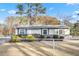 Charming single-story home featuring a covered front porch, neutral siding, and well-maintained landscaping at 1035 Stonewall Se Dr, Atlanta, GA 30315