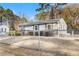 Charming single-story home featuring a covered front porch, neutral siding, and well-maintained landscaping with chain link fence at 1035 Stonewall Se Dr, Atlanta, GA 30315