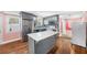 Modern kitchen with gray cabinets, an island, stainless steel appliances, and stylish backsplash at 1035 Stonewall Se Dr, Atlanta, GA 30315
