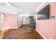 Bright open-concept living area with hardwood floors seamlessly flowing into the modern kitchen at 1035 Stonewall Se Dr, Atlanta, GA 30315