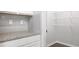 Walk-in pantry with shelving for organized storage, conveniently located in the kitchen area at 11903 Aukerman Way, Hampton, GA 30228