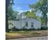 Side view of a one-story house with white siding and minimal landscaping at 1762 Hadlock Street Southwest, Atlanta, GA 30311
