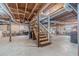 Unfinished basement with stairs leading down; perfect for storage or future home improvements at 4367 Cedar Wood Sw Dr, Lilburn, GA 30047
