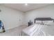 This bedroom features a plush gray carpet, closet, and neutral walls at 4367 Cedar Wood Sw Dr, Lilburn, GA 30047