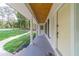 Covered front porch with white columns, painted ceiling, and welcoming front door at 4367 Cedar Wood Sw Dr, Lilburn, GA 30047
