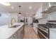 Remodeled kitchen with an island, white cabinets, stainless steel appliances, and lots of counter space at 4367 Cedar Wood Sw Dr, Lilburn, GA 30047