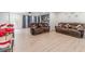 Spacious living room with matching couches, fan and easy access to outdoors at 4367 Cedar Wood Sw Dr, Lilburn, GA 30047