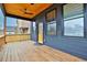 Cozy back porch featuring wood floors, railing, ceiling fan, and open backyard views at 701 Smith St, Atlanta, GA 30310