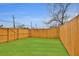 Well maintained yard is surrounded by a tall wooden privacy fence at 701 Smith St, Atlanta, GA 30310