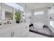 Luxurious bathroom showcasing a double vanity, marble walls, and a freestanding tub at 701 Smith St, Atlanta, GA 30310