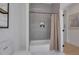 Bathroom featuring a tub/shower with gray tile and a decorative shelf and a hexagon tile floor at 701 Smith St, Atlanta, GA 30310
