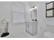 Bathroom with a modern vanity, sleek fixtures, hexagon tile floor, and a contemporary mirror at 701 Smith St, Atlanta, GA 30310