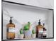 Stylish bathroom niche featuring decorative plants and upscale bath and body product bottles at 701 Smith St, Atlanta, GA 30310