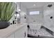 Sleek bathroom showcasing marble walls, modern fixtures, and a stylish freestanding tub at 701 Smith St, Atlanta, GA 30310