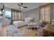Inviting bedroom featuring an electric fireplace, sitting area, desk and textured wall at 701 Smith St, Atlanta, GA 30310