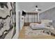 Spacious bedroom with a TV, desk, large windows, and a unique accent wall decor at 701 Smith St, Atlanta, GA 30310