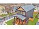 A stylish craftsman home with well manicured lawn, wood columns, railings and covered porch at 701 Smith St, Atlanta, GA 30310