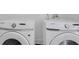 Close-up shot of two modern Samsung washing machines in a well-lit laundry room at 701 Smith St, Atlanta, GA 30310