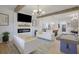 Inviting living room with fireplace, TV, and view of the modern kitchen and dining area at 701 Smith St, Atlanta, GA 30310