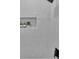 Modern shower featuring vertical tiles and a built-in niche for toiletries and decor at 701 Smith St, Atlanta, GA 30310