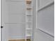 Organized walk-in closet with shelving and rod, providing ample storage space at 701 Smith St, Atlanta, GA 30310