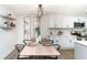 Chic dining area with stylish furniture and decor, seamlessly connected to the modern kitchen at 1091 Pine St, Conyers, GA 30012