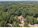 Drone shot showcasing the home nestled among lush greenery, emphasizing the privacy and serene neighborhood at 141 N. Trace, Alpharetta, GA 30009