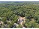 Distant aerial view of new construction in mature wooded neighborhood at 141 N. Trace, Alpharetta, GA 30009