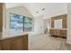 Bright bath featuring natural wood cabinets, granite counters, and a large picture window at 141 N. Trace, Alpharetta, GA 30009
