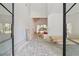 An entryway with black-trimmed windows and doors surrounded by bright, white walls is under construction at 141 N. Trace, Alpharetta, GA 30009