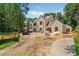Stately new construction with brick facade on a large lot with mature trees at 141 N. Trace, Alpharetta, GA 30009