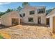 Rear exterior showcasing the home's design and potential for a beautiful outdoor space at 141 N. Trace, Alpharetta, GA 30009