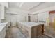Spacious kitchen island with white cabinets, creating a bright and functional culinary space at 141 N. Trace, Alpharetta, GA 30009