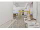 Open living area with scaffolding, cabinets, and island, ready for finishing touches at 141 N. Trace, Alpharetta, GA 30009