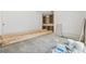 An interior living area with white walls and unfinished wooden cabinets awaiting customization to your style at 141 N. Trace, Alpharetta, GA 30009