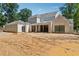 An outdoor view of the new home featuring a covered outdoor space and an attached covered garage at 141 N. Trace, Alpharetta, GA 30009