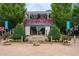 Charming restaurant exterior with flower boxes, outdoor seating, and a relaxed, welcoming atmosphere at 141 N. Trace, Alpharetta, GA 30009