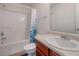 Clean bathroom featuring a tub/shower combo and a wooden vanity with a sink at 2210 Benidorm Ct, South Fulton, GA 30349