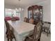 Comfortable dining area with a view into the living room, chandelier and dining table at 2210 Benidorm Ct, South Fulton, GA 30349