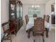 Formal dining room with an elegant china cabinet and dining set with seating for six at 2210 Benidorm Ct, South Fulton, GA 30349