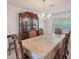 Elegant dining room with a large table set for six and a large china cabinet at 2210 Benidorm Ct, South Fulton, GA 30349