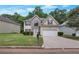 Charming two-story home featuring a well-maintained lawn and a two-car garage at 2210 Benidorm Ct, South Fulton, GA 30349